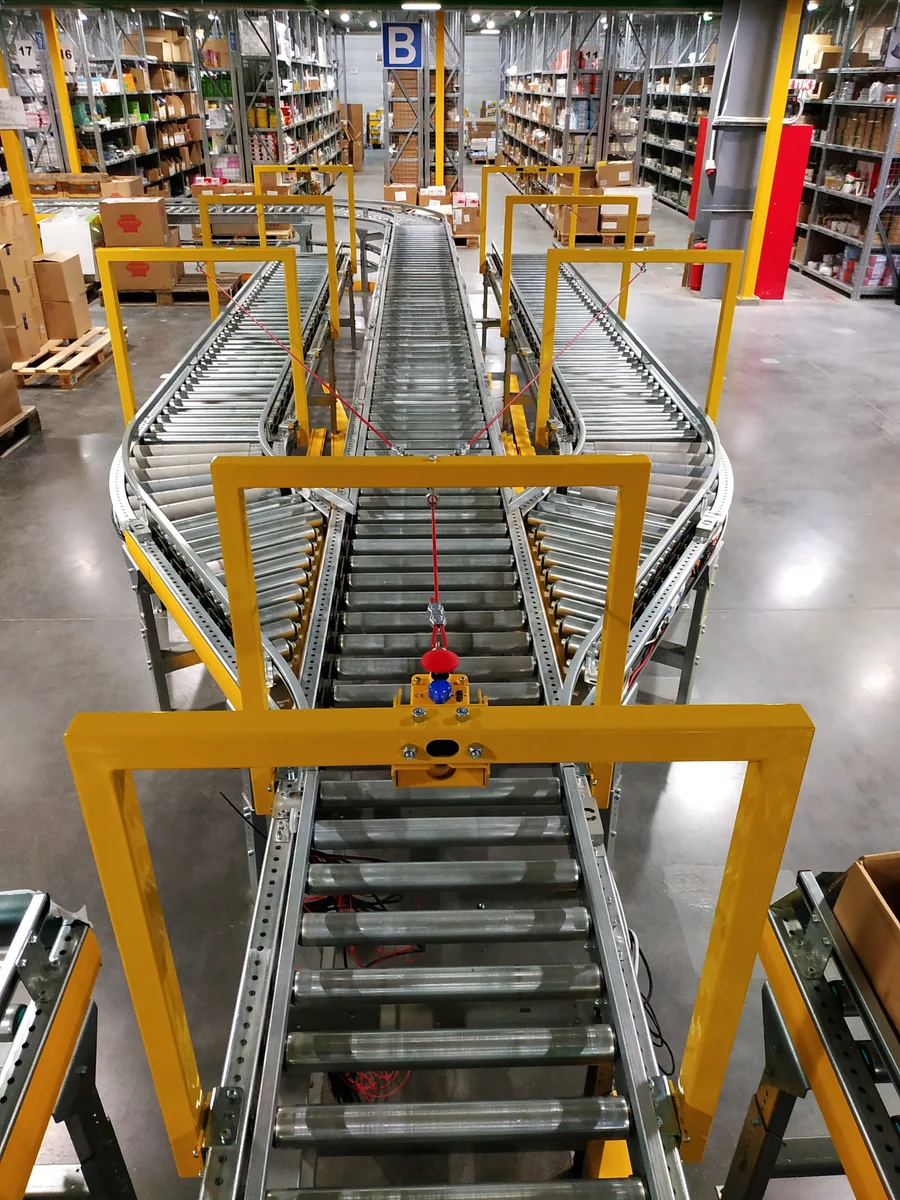 Warehouse conveyor line within a yellow support structure